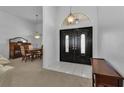Bright entryway with double doors leading into the dining and living areas at 25373 Tether Ln, Punta Gorda, FL 33983