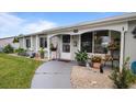 Front view of house showing entryway and landscaping at 8719 Gaillard Ave, North Port, FL 34287