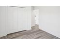Bright bedroom with wood-look flooring and double door closet at 11505 3Rd Ave, Punta Gorda, FL 33955