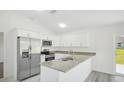 Modern kitchen with stainless steel appliances and granite countertops at 11505 3Rd Ave, Punta Gorda, FL 33955
