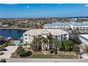 Aerial view of waterfront community with a pool and boat slips at 268 Lewis Cir # 132, Punta Gorda, FL 33950