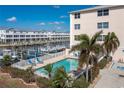 Community pool with lounge chairs and waterfront views at 268 Lewis Cir # 132, Punta Gorda, FL 33950