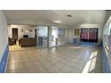 Bright Florida room with tile floors and view of living room at 554 Lindley Ter, Port Charlotte, FL 33952