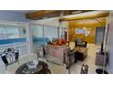 Spacious living room and dining area with wood beams at 554 Lindley Ter, Port Charlotte, FL 33952