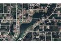 Aerial view of 198 Coblentz St, showing its waterfront location and neighborhood at 198 Coblentz St, Port Charlotte, FL 33954