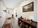 Bright and airy entryway with tile flooring and a console table at 632 Rose Apple Cir, Port Charlotte, FL 33954