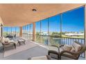 Large screened balcony with patio furniture and stunning water views at 88 Vivante Blvd # 8845/405, Punta Gorda, FL 33950