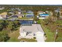 Bird's eye view of home, canal, and surrounding neighborhood at 18254 Kerrville Cir, Port Charlotte, FL 33948