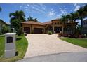 Two-story home with a three-car garage and manicured lawn at 3507 Terin Ct, Punta Gorda, FL 33950