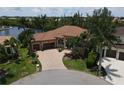 Mediterranean-style home with a tile roof and spacious driveway at 3507 Terin Ct, Punta Gorda, FL 33950