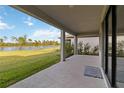 Covered patio with view of a lake at 5660 Blue Reef Pl, Nokomis, FL 34275