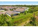 Aerial view of community and home's backyard at 15257 Mille Fiore Blvd, Port Charlotte, FL 33953