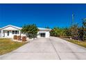 Inviting single-story home with a spacious front yard and paved driveway at 170 Chelsea Nw Ct, Port Charlotte, FL 33952