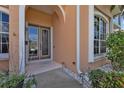 Inviting front entrance with double doors and stone accents at 2388 Silver Palm Rd, North Port, FL 34288