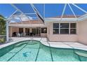 Relaxing pool area with a screened enclosure and a tiled deck at 2507 Via Veneto Dr, Punta Gorda, FL 33950