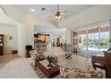 Spacious living room with an open floor plan and access to the pool area at 2507 Via Veneto Dr, Punta Gorda, FL 33950