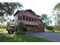 Two-story home with a screened porch and a large deck at 3681 Hidden Valley Cir, Punta Gorda, FL 33982