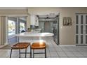 Modern kitchen with breakfast bar and stainless steel appliances at 167 Mocha Ct, Punta Gorda, FL 33983