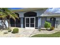 Front view of a house with a screened porch at 1900 Nuremberg Blvd, Punta Gorda, FL 33983