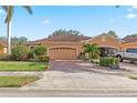 Inviting home with a two-car garage and landscaped yard at 4410 Turnberry Cir, North Port, FL 34288