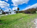 White single story home with screen porch at 930 Liberty St, Englewood, FL 34223