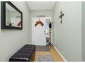 Light and bright entryway with seating and decor at 19310 Water Oak Dr # 203, Port Charlotte, FL 33948