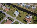 Aerial view showing the house's location and lot size next to a canal at 22532 Ashton Ave, Punta Gorda, FL 33980