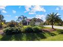 Landscaped front yard of a one-story home at 2705 Lamkin Rd, North Port, FL 34288