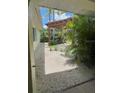 Backyard features a pergola and a stone-covered landscape at 4290 Randypaar St, Port Charlotte, FL 33948