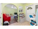 Entryway with view into living room and workspace at 4290 Randypaar St, Port Charlotte, FL 33948