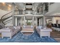 High ceilings and an open floor plan with a stunning staircase at 4601 Grassy Point Blvd, Port Charlotte, FL 33952