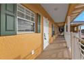 Building hallway with access to unit, showing exterior features at 3216 Purple Martin Dr # 122, Punta Gorda, FL 33950