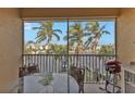 Spacious lanai with water views, outdoor table, and grill at 3216 Purple Martin Dr # 122, Punta Gorda, FL 33950