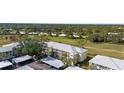 Aerial view of condo building near golf course at 433 Cerromar Ln # 441, Venice, FL 34293