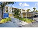Building exterior showcasing parking and landscaping at 433 Cerromar Ln # 441, Venice, FL 34293