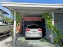 Covered carport area with space for one vehicle at 107 Dunn Ne Dr, Port Charlotte, FL 33952