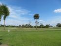 Landscaped golf course with lush green fairways at 1360 Rio De Janeiro Ave # 117, Punta Gorda, FL 33983