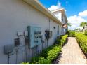 Exterior view of building with multiple electrical meters at 14009 Black Beauty Dr # 212, Punta Gorda, FL 33955