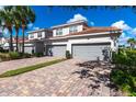Townhouse with two-car garage and brick paver driveway at 14009 Black Beauty Dr # 212, Punta Gorda, FL 33955