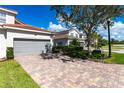 Townhouse with two-car garage and brick paver driveway at 14009 Black Beauty Dr # 212, Punta Gorda, FL 33955