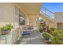 Small patio with seating and potted plants at 1512 Rio De Janeiro Ave # 111, Punta Gorda, FL 33983