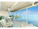 Spacious sunroom boasts stunning water views and relaxing furniture at 1650 W Marion Ave # 144, Punta Gorda, FL 33950