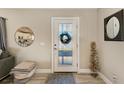 Bright entryway with a modern door and decorative accents at 21341 Edgewater Dr, Port Charlotte, FL 33952
