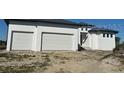 New construction home with a three-car garage at 24092 Potosi Ct, Punta Gorda, FL 33955