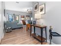 Bright and spacious entryway with wood-look floors and views to the living room at 12333 Willmington Blvd, Port Charlotte, FL 33981