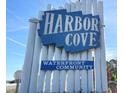 Harbor Cove waterfront community sign welcomes you to this tranquil neighborhood at 207 Blackburn Blvd, North Port, FL 34287
