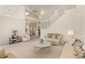 Spacious living room with high ceilings, two sofas, and a coffee table at 3800 Bal Harbor Blvd # 312, Punta Gorda, FL 33950