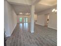 Spacious open-concept living room with recessed lighting and stylish tile flooring at 14146 Baracoa Ln, Port Charlotte, FL 33981
