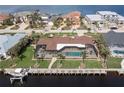 Aerial view of canal front home with private pool and dock at 1925 Jamaica Way, Punta Gorda, FL 33950