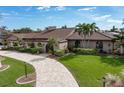 House exterior featuring a brown tile roof and landscaped yard at 1925 Jamaica Way, Punta Gorda, FL 33950